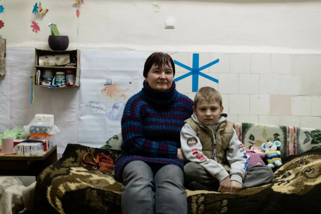 Yulia and her son in a bomb shelter