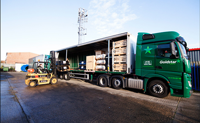 Aid being loaded onto lorries from  Oxfam's distribution centre in Bicester UK