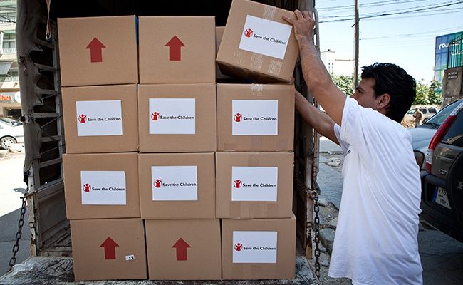 Save the Children staff prepare to deliver aid to Syrian refugees in Lebanon