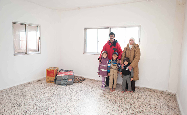 Syrian refugee family living in empty flat in Jordan