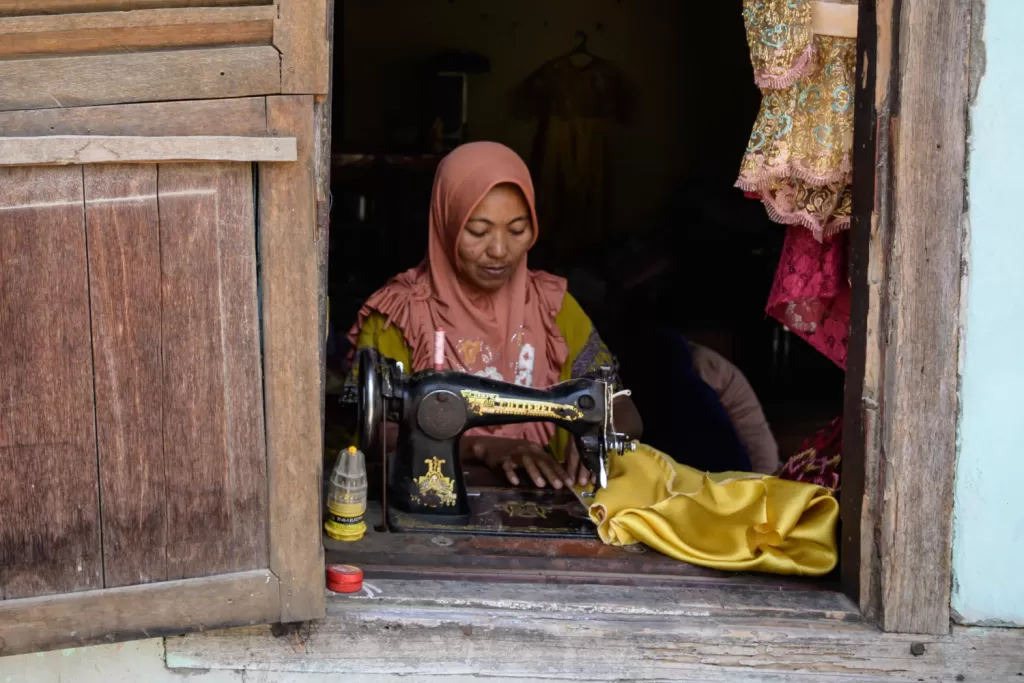 A woman uses a sewing machine