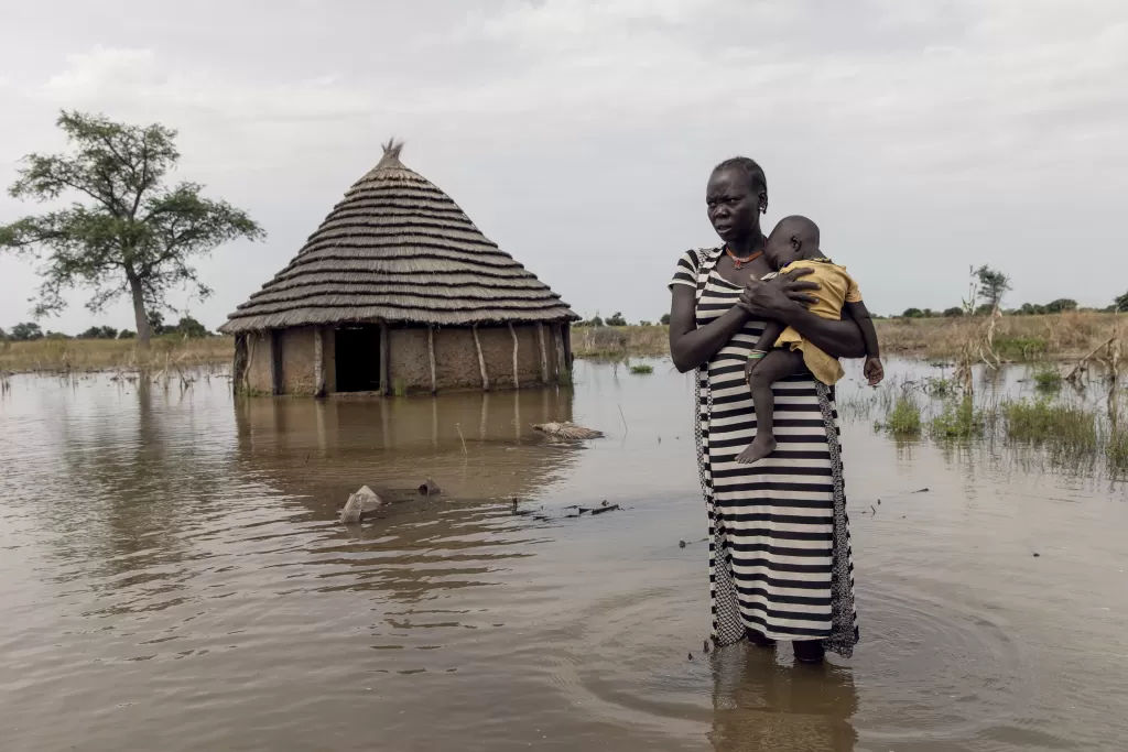 International Rescue Committee photo from South Sudan of lady holding baby in floods