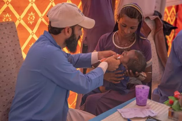 Naju’s baby receives nutritional peanut paste that can be lifesaving for malnourished children, at a clinic supported by Concern Worldwide in Sindh.