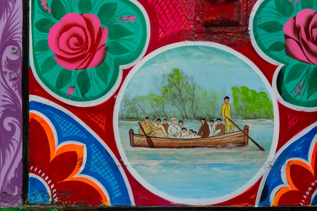 Image of flood survivors in a boat painted on the aid truck